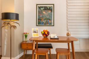a dining room table with a bowl of fruit on it at Hotel Elite in Rome