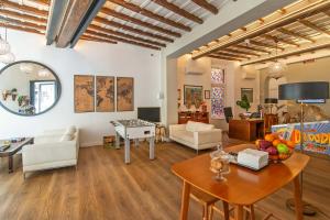 a living room with white furniture and a table at Hotel Elite in Rome +68 photos