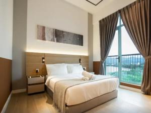a bedroom with a large bed and a large window at Liwan, Baysuite by Ayuhouz in Kota Kinabalu +71 photos