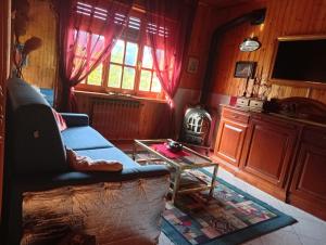a living room with a couch and a table at Remig Ranch CIR 0001 in Challand Saint Victor