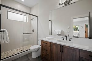 a bathroom with a sink and a toilet and a shower at 18171-2 Forestbrook Loop in Bend