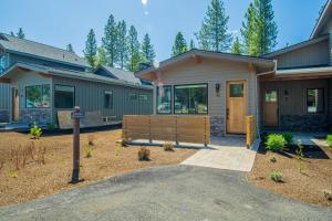 a house with a bench in front of it at 18171-2 Forestbrook Loop in Bend