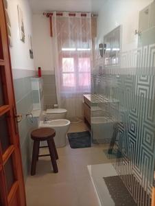 a bathroom with a toilet and a glass shower at Remig Ranch CIR 0001 in Challand Saint Victor