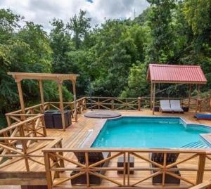a swimming pool on a deck with a gazebo at Careffe Escape Hideaway in Monchy