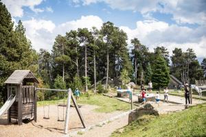 a group of people playing in a playground at Huttopia Font Romeu in Font-Romeu
