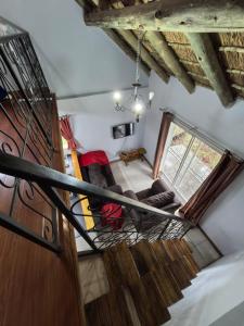 a spiral staircase in a room with a room at Frangipani guesthouse in Hartbeespoort