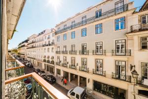 an apartment balcony with a view of a street at GS Chiado Boutique Studios & Suites in Lisbon