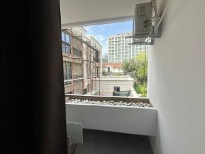 a window with a view of a building at Old Town Apart in Budva
