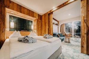 a bedroom with two large beds in a room at Sendlhofer's in Bad Hofgastein