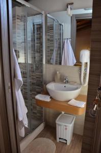 a bathroom with a sink and a shower at B&B Casa Bellavista in Castelmola +76 photos