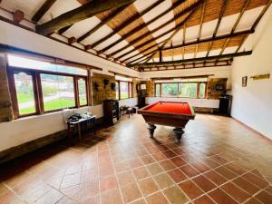 a large room with a pool table in it at Hacienda Campestre Oasis de la Villa in Villa de Leyva