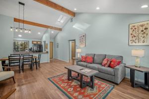 a living room with a couch and a table at 4 Quelah Condo in Sunriver