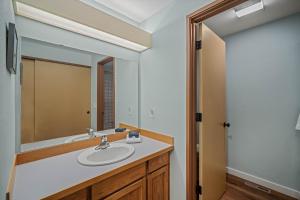 a bathroom with a sink and a mirror at 4 Quelah Condo in Sunriver