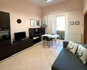 a living room with a couch and a table at Corso Ovidio - Casa vacanze in Sulmona