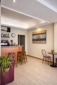 a lobby of a hotel with chairs and a bar at Hostal Ruiz in Soria