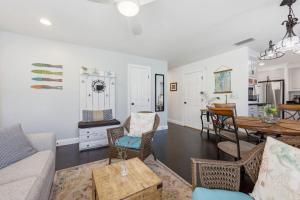 a living room with a couch and a table at Weeden Cottage in St. Augustine