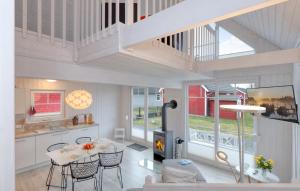 a kitchen and a living room with a table and a fireplace at Hafenhaus Zerpenschleuse in Wandlitz