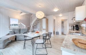 a living room with a couch and a table and chairs at Hafenhaus Zerpenschleuse in Wandlitz +19 photos