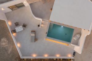 an overhead view of a swimming pool in a building at Villa Leuki in Adamantas
