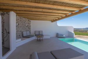 an external view of a house with a swimming pool at Villa Leuki in Adamantas