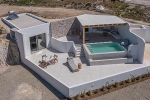 an overhead view of a house with a swimming pool at Villa Leuki in Adamantas