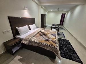 a bedroom with a large bed in a room at Little Tibet Mcleodganj in Dharmsāla