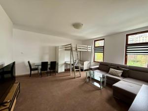 a living room with a couch and a table at JustInRent Family Szpitalna 4D-3 in Legnica