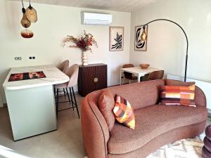 a living room with a couch and a table at Vakantiewoning Koestraat 48A met strandcabine in Westkapelle