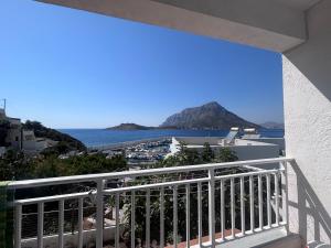 a balcony with a view of the ocean at Fotinis Apartment in Kalymnos