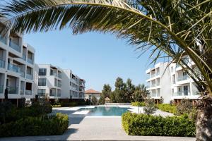 a view of an apartment complex with a swimming pool at Tatilçi Baba in Mekhrably