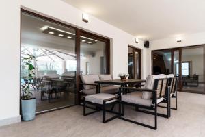 a dining room with a table and chairs at Villa Sunce in Visoko