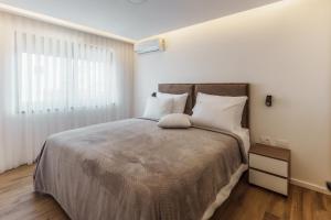 a bedroom with a large bed and a window at Villa Sunce in Visoko +58 photos