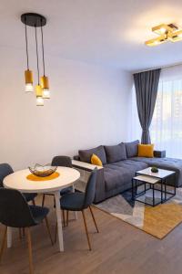 a living room with a couch and a table at Boutique apartment 4 in Plovdiv