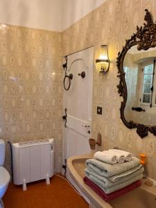 a bathroom with a sink and a mirror at Chez les artistes in Servian +122 photos