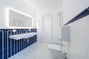 a bathroom with a white toilet and a sink at San Francesco Amalfi Coast Hotel in Maiori