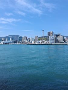 a large body of water with a city in the background at 부산남포 프론트오션뷰 in Busan
