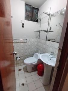 a bathroom with a toilet and a sink at MNk HOTEL in Arequipa