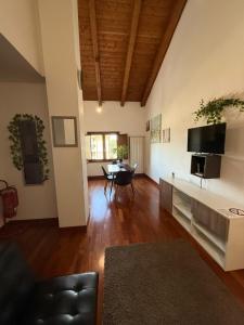a large living room with a couch and a tv at Casa Camelia in Zagarolo