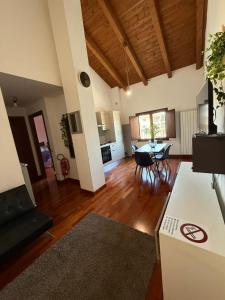 a living room with a kitchen and a dining room at Casa Camelia in Zagarolo +27 photos