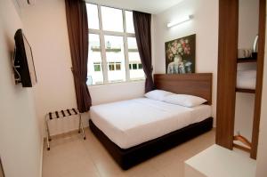 Postel nebo postele na pokoji v ubytování Hotel Cheqinn