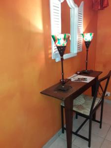 a table with a mirror and a table with a chair at Chambres Dubuisson de Bray in Bray +14 photos