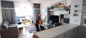 a living room with a couch and a table at Apartmán Vlasta in Arona