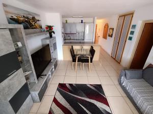 a living room with a couch and a table at Apartmán Vlasta in Arona
