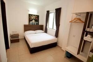 Postel nebo postele na pokoji v ubytování Hotel Cheqinn