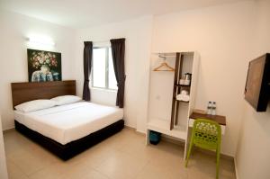 Postel nebo postele na pokoji v ubytování Hotel Cheqinn