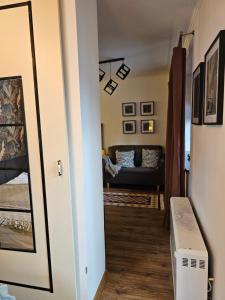 a hallway with a living room with a couch at U Efci in Kościelisko