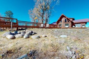 a group of rocks in front of a house at Rivercrest in South Fork
