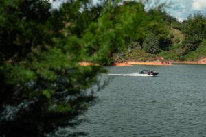 a boat in the water on a lake at Porto Marina Hotel in Guatapé