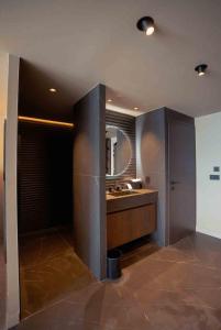 a bathroom with a sink and a mirror at Fahrenheit Seven Les Menuires in Les Menuires