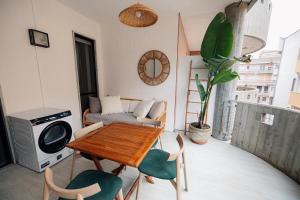 a small living room with a table and chairs at Salento IBIZA in Gallipoli